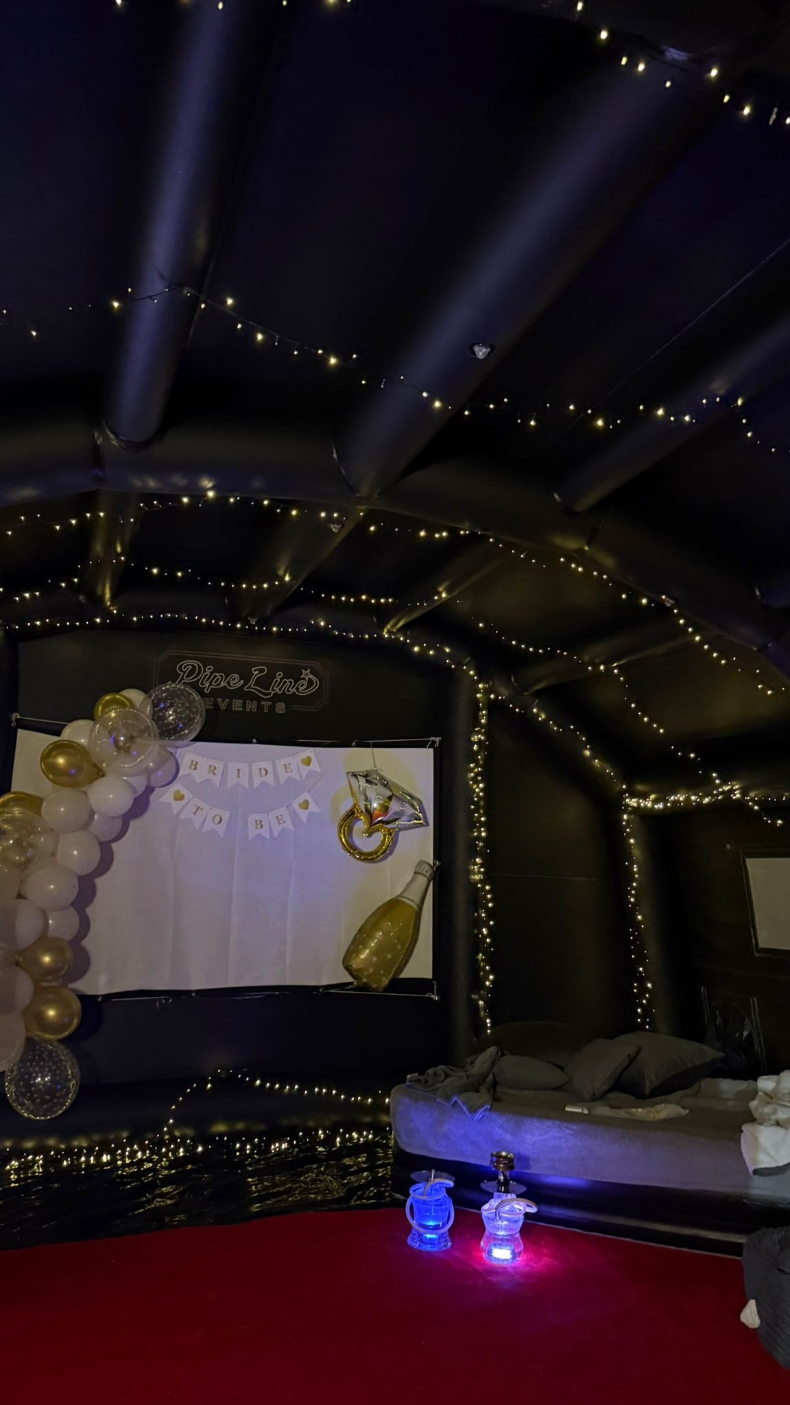 Bride to be celebration setup inside the marquee with balloons and fairy lights
