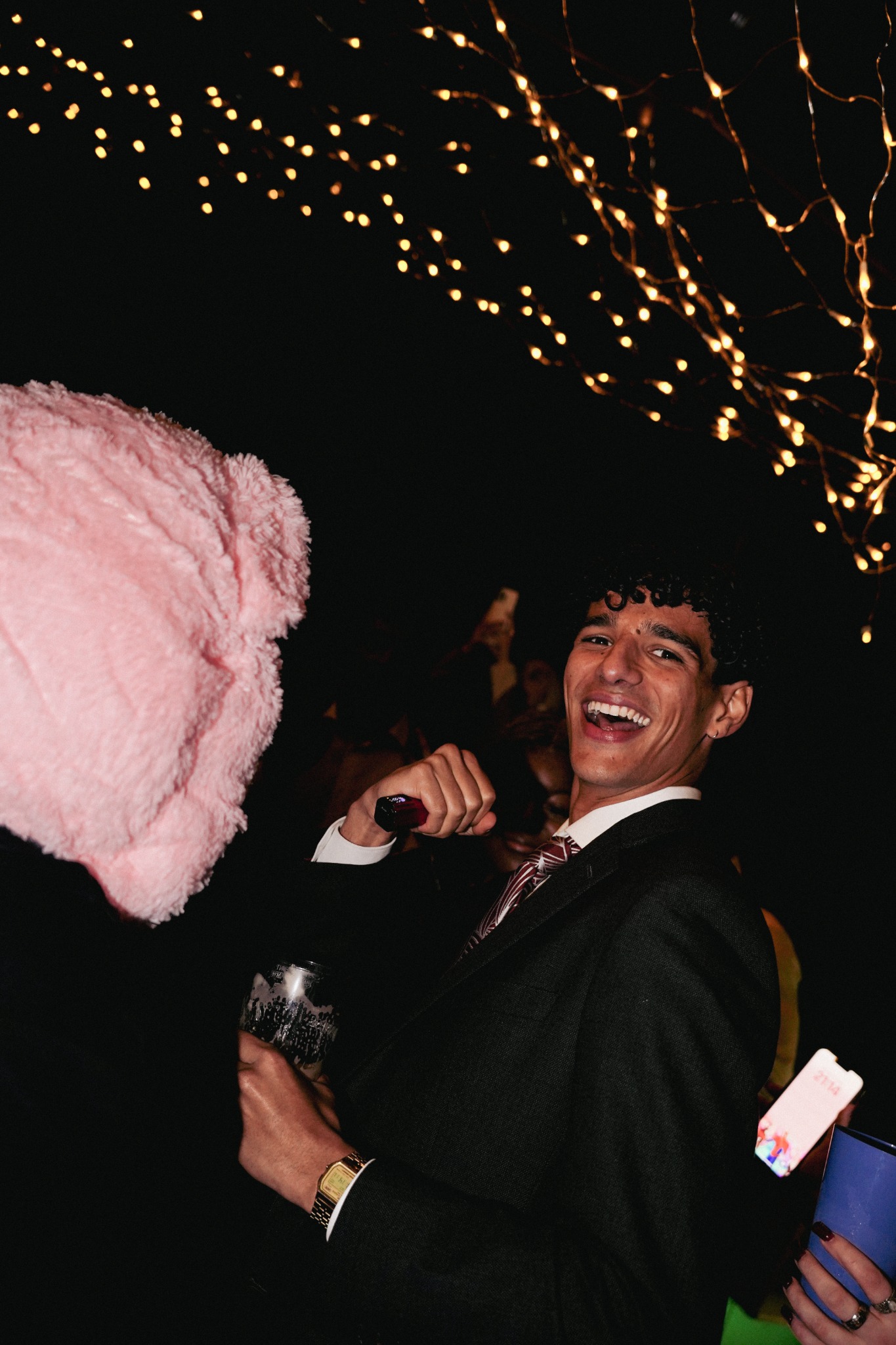 Guest enjoying the party under the bespoke events space lights