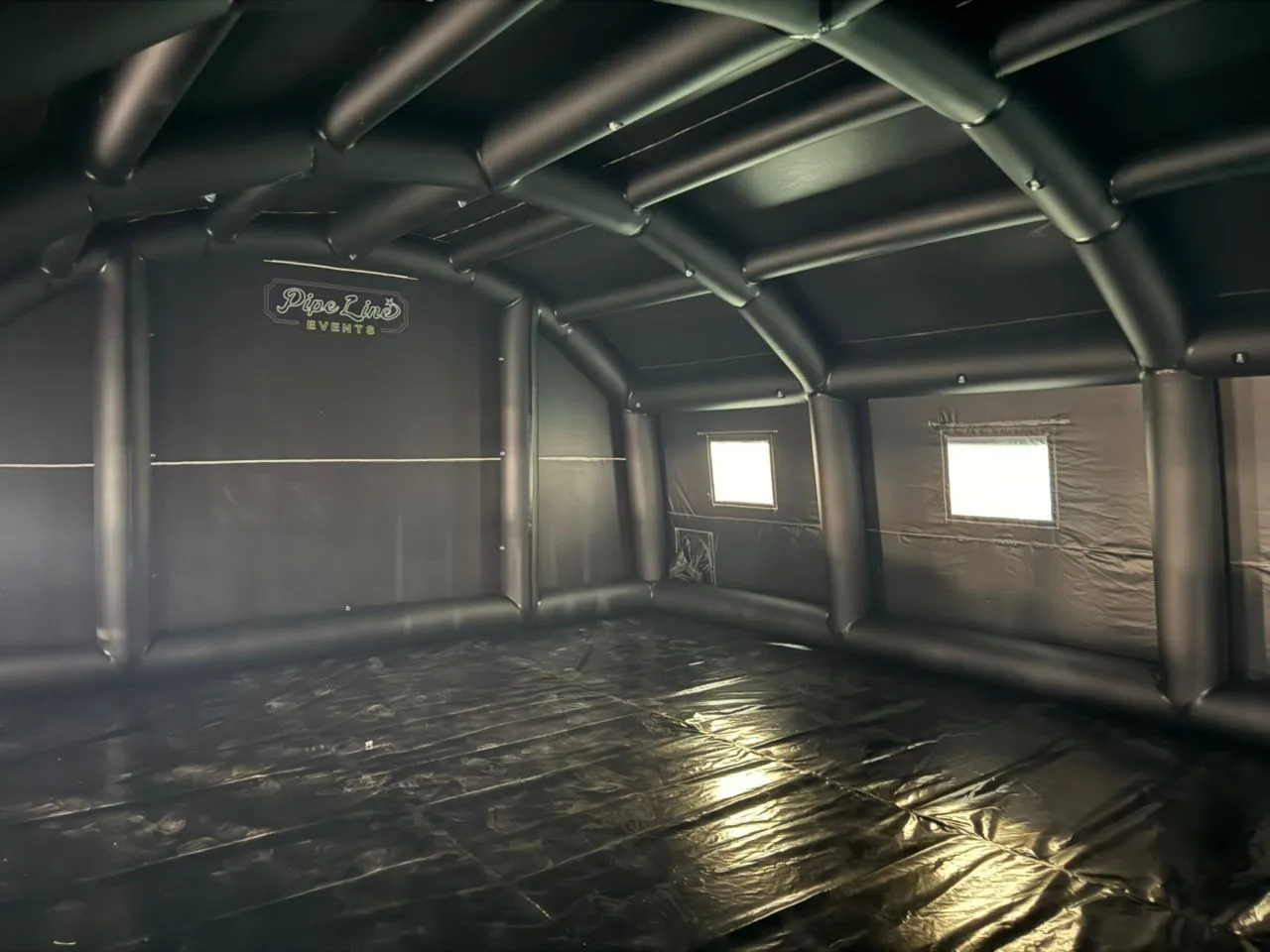 Empty Midnight Suite before styling, black inflatable walls and floor